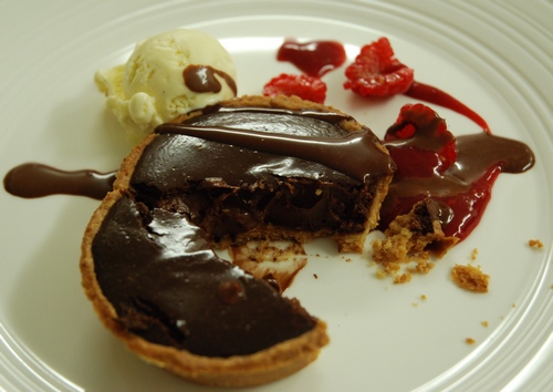 William Curley warm chocolate tart Warm Amedei '9' chocolate tart with raspberry sauce and vanilla ice cream